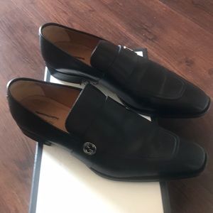 Gucci men’s black leather loafers